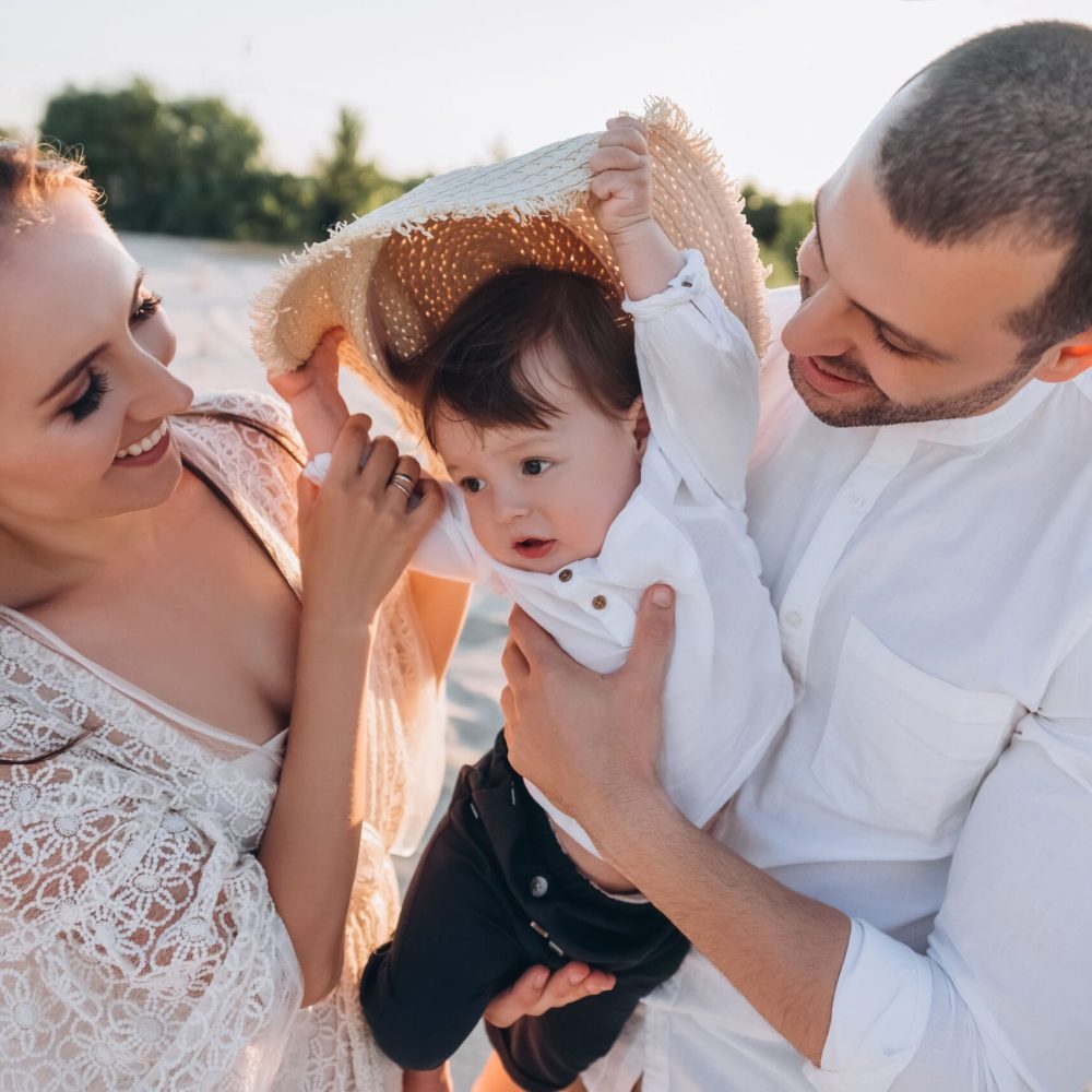 happy family with baby boy on beach